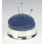 A circular silver pin cushion Birmingham 1919, 11cm