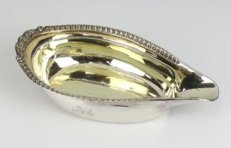 A George III silver pap boat with egg and dart rim and engraved monogram London 1809, 13cm, 80 grams