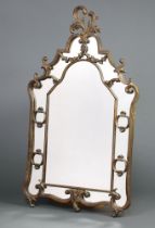 An Italian style arched plate mirror contained in a painted gilt frame 112cm h x 74cm w This lot