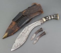 A Kukri, the blade marked Military Supply Syndicate complete with 2 skinning knives, leather