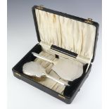 An Art Deco silver engine turned dressing table set comprising hair brush mirror and comb (comb a/f)