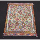 A yellow, green and turquoise ground Chobi Kilim rug with all over geometric designs 190cm x 129cm