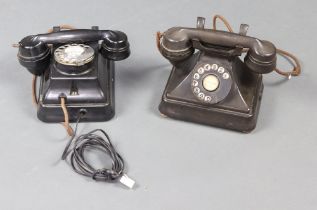 A Siemens Brothers black Bakelite wall telephone, together with a black Bakelite dial telephone (