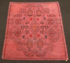 A red and black ground Afghan rug with geometric designs 196cm x 163cm Some staining in places