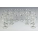 A set of 12 Italian moulded glass wine glasses with bobble stems