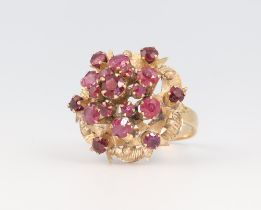 A yellow metal 18k garnet cluster ring 4.7 grams, size K 1/2