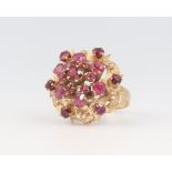 A yellow metal 18k garnet cluster ring 4.7 grams, size K 1/2