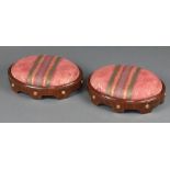 A pair of Regency oval walnut and gilt studded footstools with drop in seats 10cm x 38cm x 27cm