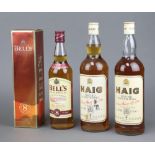 Two litre bottles of Haig Fine Old Scotts Whisky, a 70cl bottle of Bells 8 year old Scotts Whisky