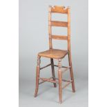 A 19th Century mahogany bar back child's training chair 94cm h x 30cm w x 22cm d The bar back is
