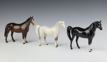 A Beswick figure Arab Xayal No 1265 black gloss 2 white socks 15cm, ditto rocking horse grey 15cm