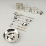 A silver pin tray London 1921, 4 spoons, 3 napkin rings, 2 mother of pearl handled forks and a