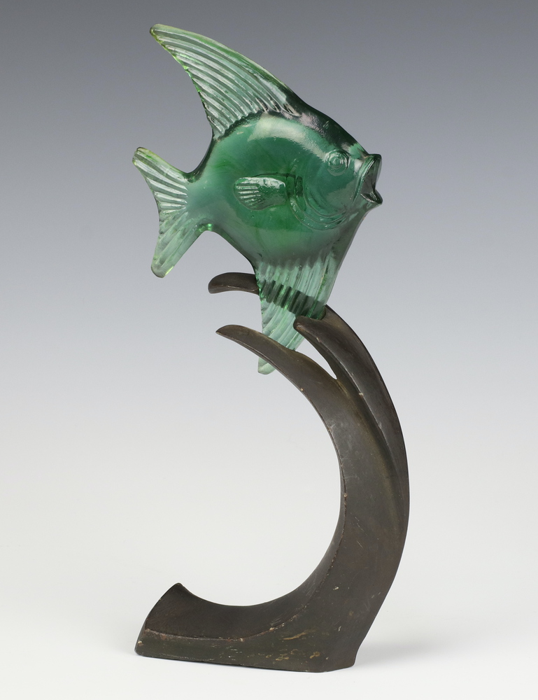 A Bermondsey green glass figure of an angel fish on a cast bronze base int the form of waves, in the