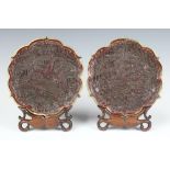 A pair of 19th Century brass mounted carved Cinnabar lacquer trays decorated with figures in a