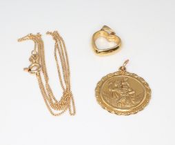 A 9ct yellow gold St Christopher 3.1 grams, a yellow metal 14k chain 1.1 grams and an 18ct yellow