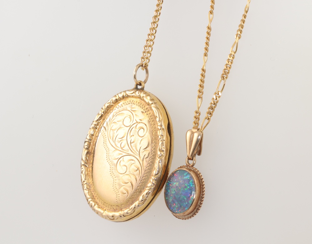 A 9ct yellow gold necklace 3.5 grams 40cm with an oval gilt locket, together with a 9ct yellow