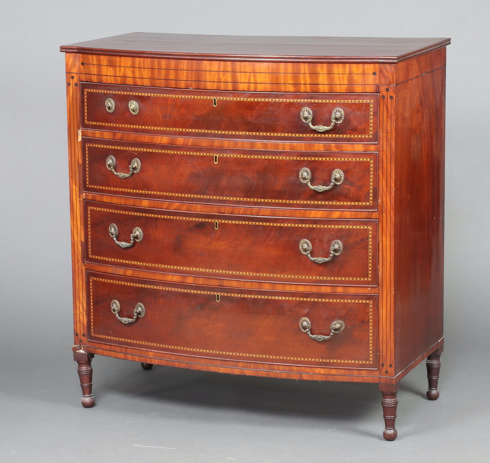 A 19th Century inlaid mahogany bow front chest of 4 long graduated drawers with gilt metal swan neck