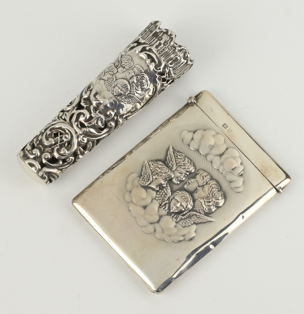 An Edwardian repousse silver card case decorated with Reynolds Angels Birmingham 1905 together