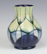 A Moorcroft vase decorated the Indigo pattern, designed by Emma Bossons, circa 1999, base