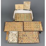 A bamboo Mahjong set comprising 147 tiles together with 99 bone counting sticks (3 a/f)