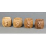 Robert "Mouseman" Thompson of Kilburn, a set of 4 octagonal carved oak napkin rings, each with a