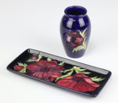 A rectangular Moorcroft pin tray decorated anemones, base impressed Moorcroft 34/94 20cm together