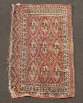 A section of red and blue ground Bokhara rug 110cm x 65cmSome moth, patched