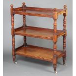 A Victorian rectangular mahogany 3 tier buffet on turned and block supports with ceramic casters