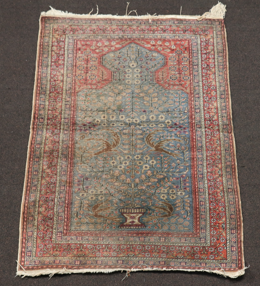 A Caucasian style prayer rug with mihrab 103cm x 90cm In wear, fringe reduced