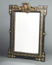 A 19th Century Continental rectangular plate mirror contained in a gilt and ebonised frame