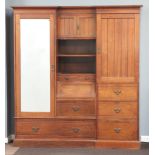 A Victorian mahogany break front double wardrobe with shaped and moulded cornice, the centre hanging