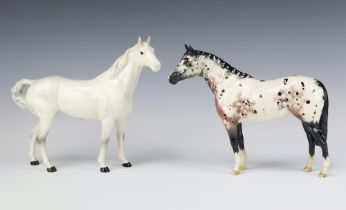 A Beswick figure of a standing Appaloosa stallion No 1772, 21cm (back leg f and r) together with a