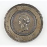 A white metal commemorative medallion