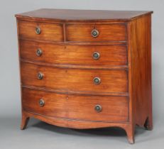 A 19th Century crossbanded mahogany bow front chest of 2 short and 3 long drawers with replacement