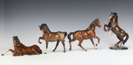 A Beswick figure of a Welsh Cob rearing brown gloss No 1014 by Arthur Gredington 26cm, 18cm, a ditto