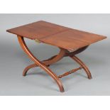 A 19th Century style rectangular mahogany folding coaching table raised on X shaped supports with