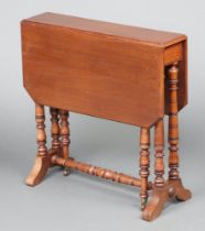 A Victorian mahogany Sutherland table raised on turned supports with turned H framed stretcher