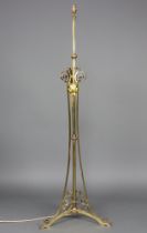 A 19th Century gilt metal standard oil lamp converted to an electric standard lamp, raised on gilt