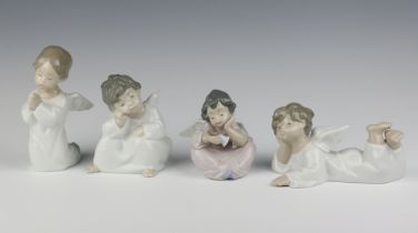 Four Nao figures of seated angels 11cm x 7cm