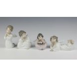 Four Nao figures of seated angels 11cm x 7cm