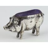 An Edwardian style silver pin holder in the form of a standing pig 5.5cm