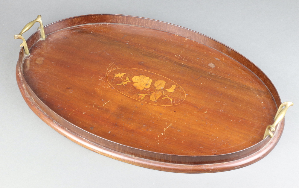 An Edwardian oval inlaid mahogany twin handled tea tray with floral decoration 5cm x 46cm x 36cm