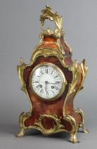 A 19th/20th Century French 8 day mantel clock with 10cm enamelled dial, Roman numerals, contained in