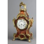 A 19th/20th Century French 8 day mantel clock with 10cm enamelled dial, Roman numerals, contained in