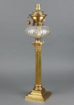 A Victorian faceted glass oil lamp reservoir raised on a Corinthian column and stepped base 52cm h x