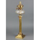 A Victorian faceted glass oil lamp reservoir raised on a Corinthian column and stepped base 52cm h x