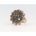 A yellow metal gem set cluster ring 6.2 grams, size L