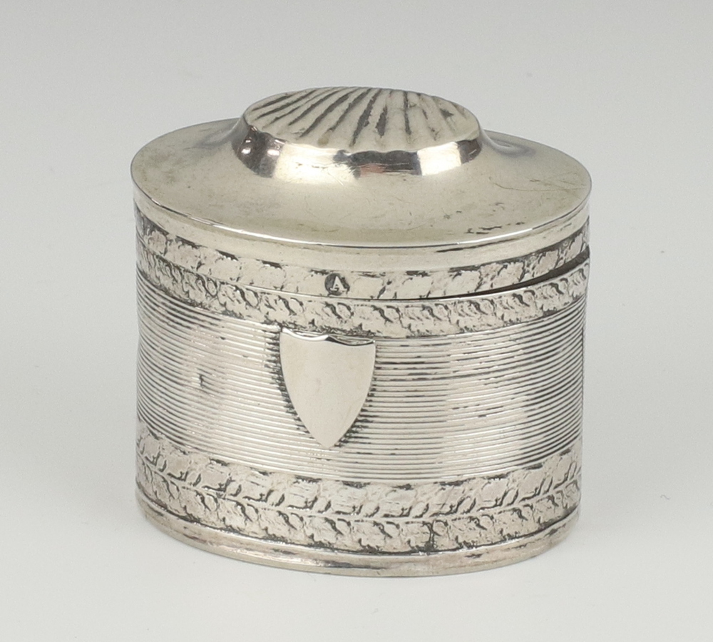 A 19th Century Dutch oval silver cashew box with shell decoration and vacant cartouche 4cm, 18.7