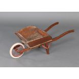 A child's wooden wheelbarrow with solid rubber tyre 79cm h x 76cm w x 35cm d