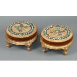 A pair of Victorian circular gilt painted footstools with beadwork upholstery, raised on cabriole